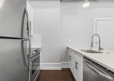 Newly renovated kitchen with stainless steel appliances at Dickinson Lofts luxury lofts for rent in Grays Ferry