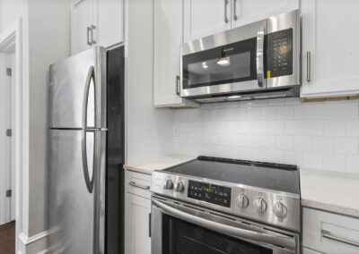 Stainless steel appliances in newly renovated kitchen at Dickinson Lofts luxury lofts for rent in Grays Ferry