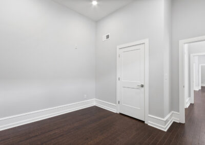 Living space with hardwood floors and high ceilings at Dickinson Lofts luxury lofts for rent in Grays Ferry