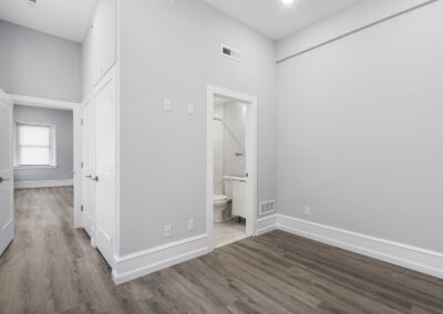 Large living space with hardwood floors and high ceilings at Dickinson Lofts luxury lofts for rent