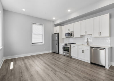 Large newly renovated kitchen with hardwood floors and stainless steel appliances at Dickinson Lofts luxury lofts for rent