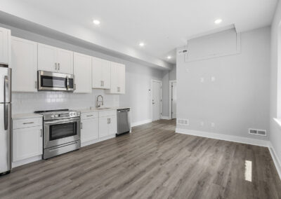 Large newly renovated kitchen with hardwood floors and stainless steel appliances at Dickinson Lofts luxury lofts for rent